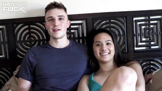 Couple mid-scene in a dim bedroom