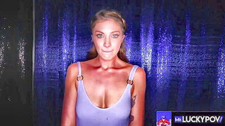 Solo performer with a toy on rumpled bedsheets