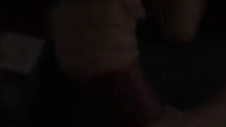 Amateur couple on a living room sofa in explicit scene