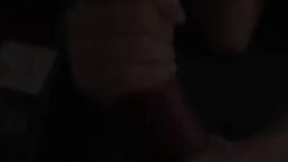 Amateur couple on a living room sofa in explicit scene