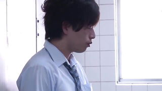 Couple mid-scene in a dim bedroom