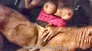 Couple mid-scene in a dim bedroom