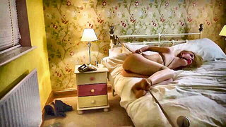 Pair of performers in motion on a wide bed