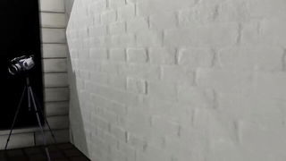 Explicit massage scene in a softly lit room