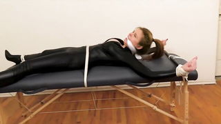 Couple mid-scene in a dim bedroom