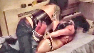 Explicit doggy style scene on a wide bed