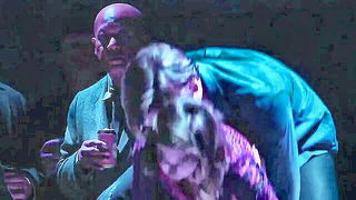 Explicit massage scene in a softly lit room