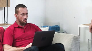 Couple on a made bed in an explicit scene