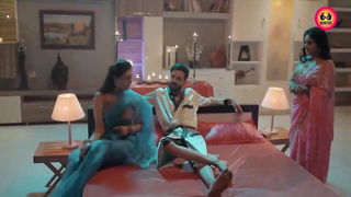 Explicit massage scene in a softly lit room