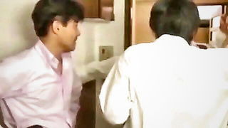 Couple mid-scene in a dim bedroom
