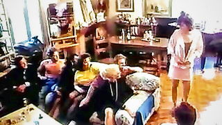 Amateur couple on a living room sofa in explicit scene