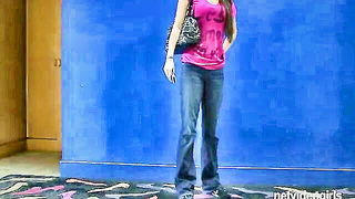 Solo performer with a toy on rumpled bedsheets