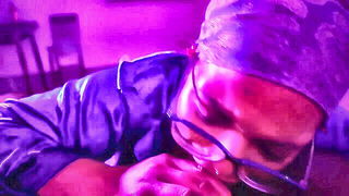 Explicit massage scene in a softly lit room
