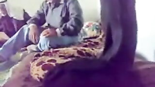 Explicit massage scene in a softly lit room