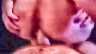 Explicit doggy style scene on a wide bed