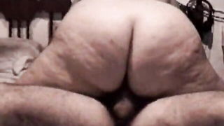 Explicit doggy style scene on a wide bed