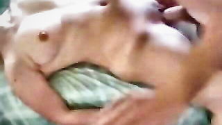 Explicit doggy style scene on a wide bed