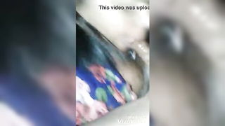Solo performer with a toy on rumpled bedsheets