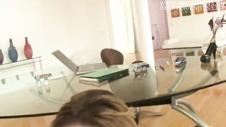 Couple on a made bed in an explicit scene