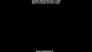 Amateur couple on a living room sofa in explicit scene