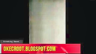 Amateur couple on a living room sofa in explicit scene