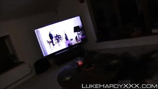 Amateur couple on a living room sofa in explicit scene