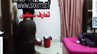 Amateur couple on a living room sofa in explicit scene