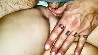 Explicit massage scene in a softly lit room