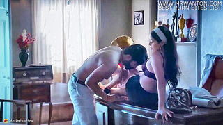 Couple mid-scene in a dim bedroom