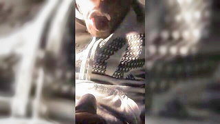 Amateur couple on a living room sofa in explicit scene