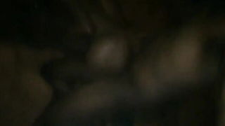 Amateur couple on a living room sofa in explicit scene