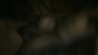 Amateur couple on a living room sofa in explicit scene