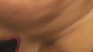 Amateur couple on a living room sofa in explicit scene