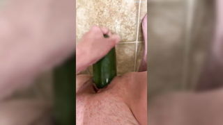 Couple on a made bed in an explicit scene
