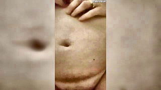 Explicit massage scene in a softly lit room