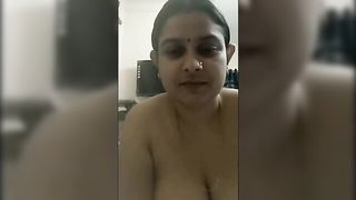Couple on a made bed in an explicit scene