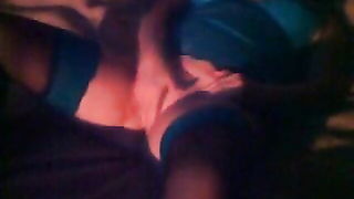 Amateur couple on a living room sofa in explicit scene