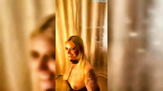 Explicit massage scene in a softly lit room