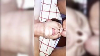 Explicit massage scene in a softly lit room
