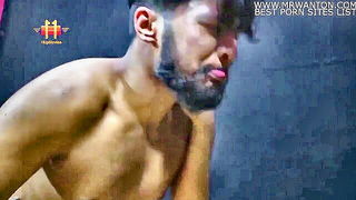 Solo performer with a toy on rumpled bedsheets