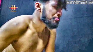 Solo performer with a toy on rumpled bedsheets
