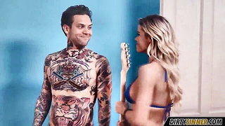 Couple mid-scene in a dim bedroom