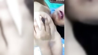 Explicit massage scene in a softly lit room