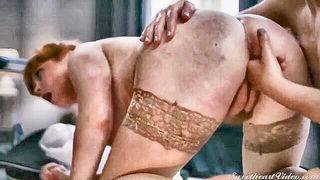 Explicit doggy style scene on a wide bed