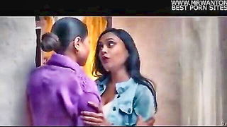Couple mid-scene in a dim bedroom