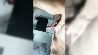 Couple mid-scene in a dim bedroom