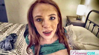 Solo performer with a toy on rumpled bedsheets