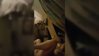 Couple on a made bed in an explicit scene