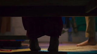 Explicit massage scene in a softly lit room