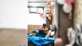 Couple mid-scene in a dim bedroom